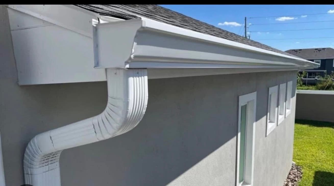 White gutter system detail on a home